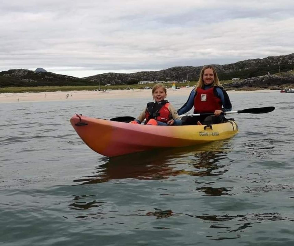 Visitirs from the Croft Cabin in kayak at Achmelvich.